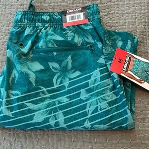 Men’s turquoise, Hawaiian swim shorts